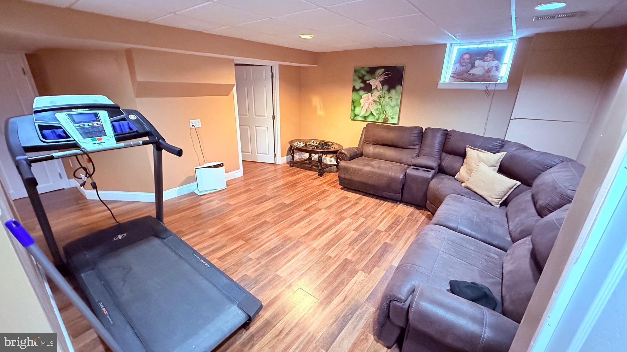 8905 Springview Road Philadelphia, PA 19115 - Photo 69 of 113 a living room with furniture and a wooden floor