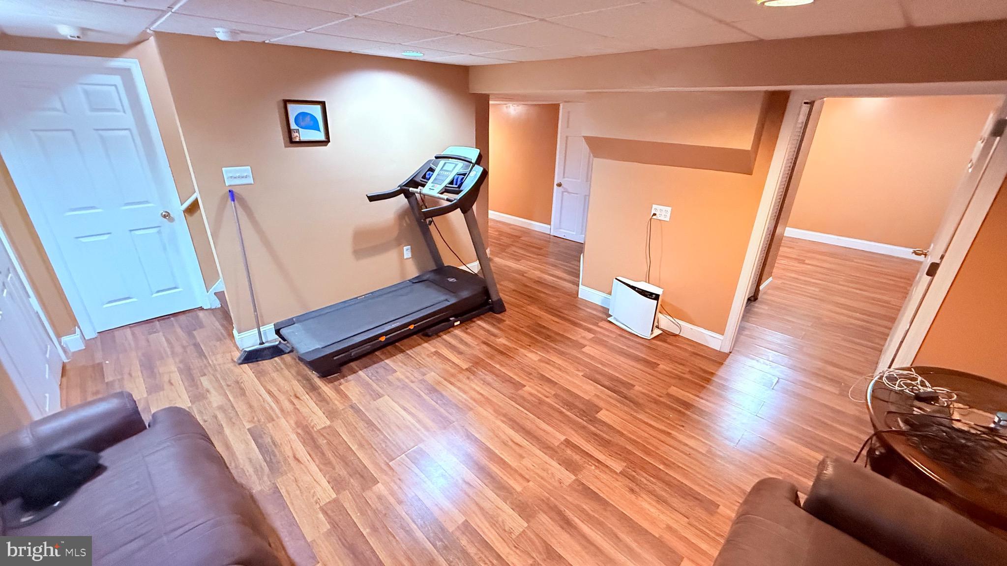 8905 Springview Road Philadelphia, PA 19115 - Photo 70 of 113 a view of a hallway with wooden floor and staircase