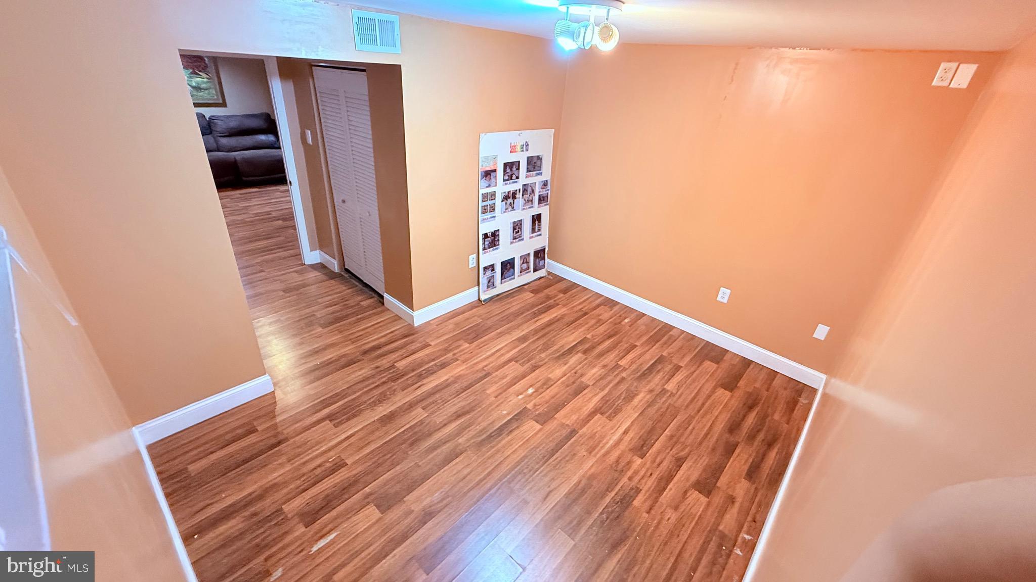 8905 Springview Road Philadelphia, PA 19115 - Photo 73 of 113 a view of an empty room with wooden floor and closet