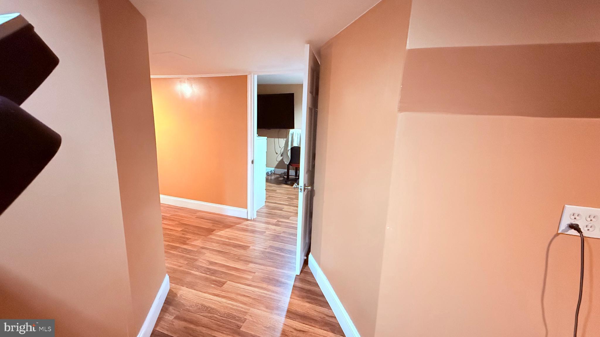8905 Springview Road Philadelphia, PA 19115 - Photo 75 of 113 a view of hallway with stairs and wooden floor