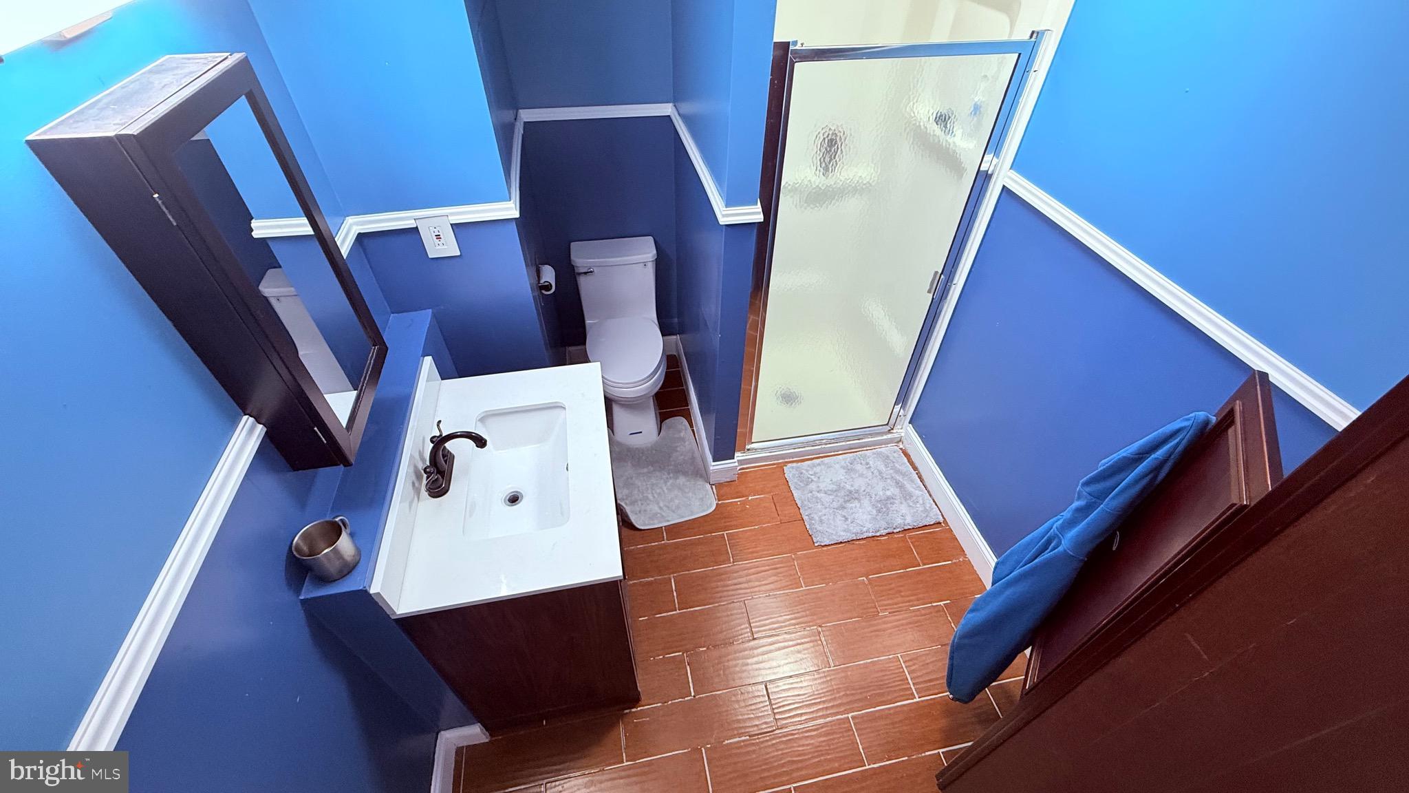 8905 Springview Road Philadelphia, PA 19115 - Photo 79 of 113 a view of a kitchen with wooden floor and electronic appliances