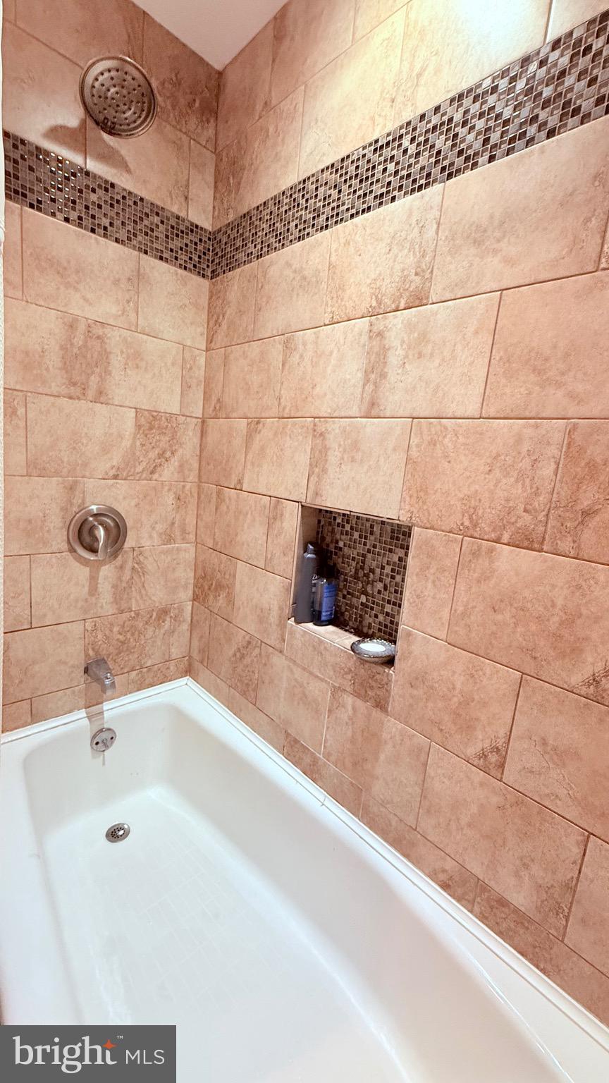 8905 Springview Road Philadelphia, PA 19115 - Photo 95 of 113 a bathroom with a bathtub and shower