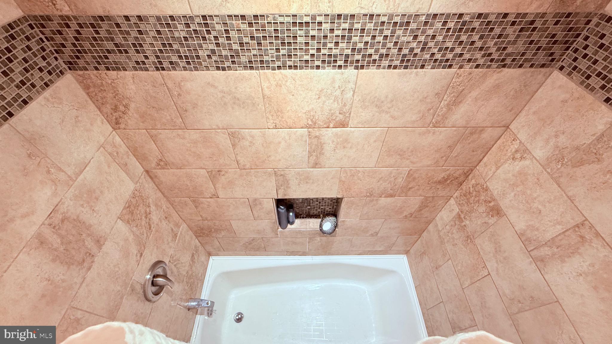 8905 Springview Road Philadelphia, PA 19115 - Photo 96 of 113 a bathroom with a bathtub and shower