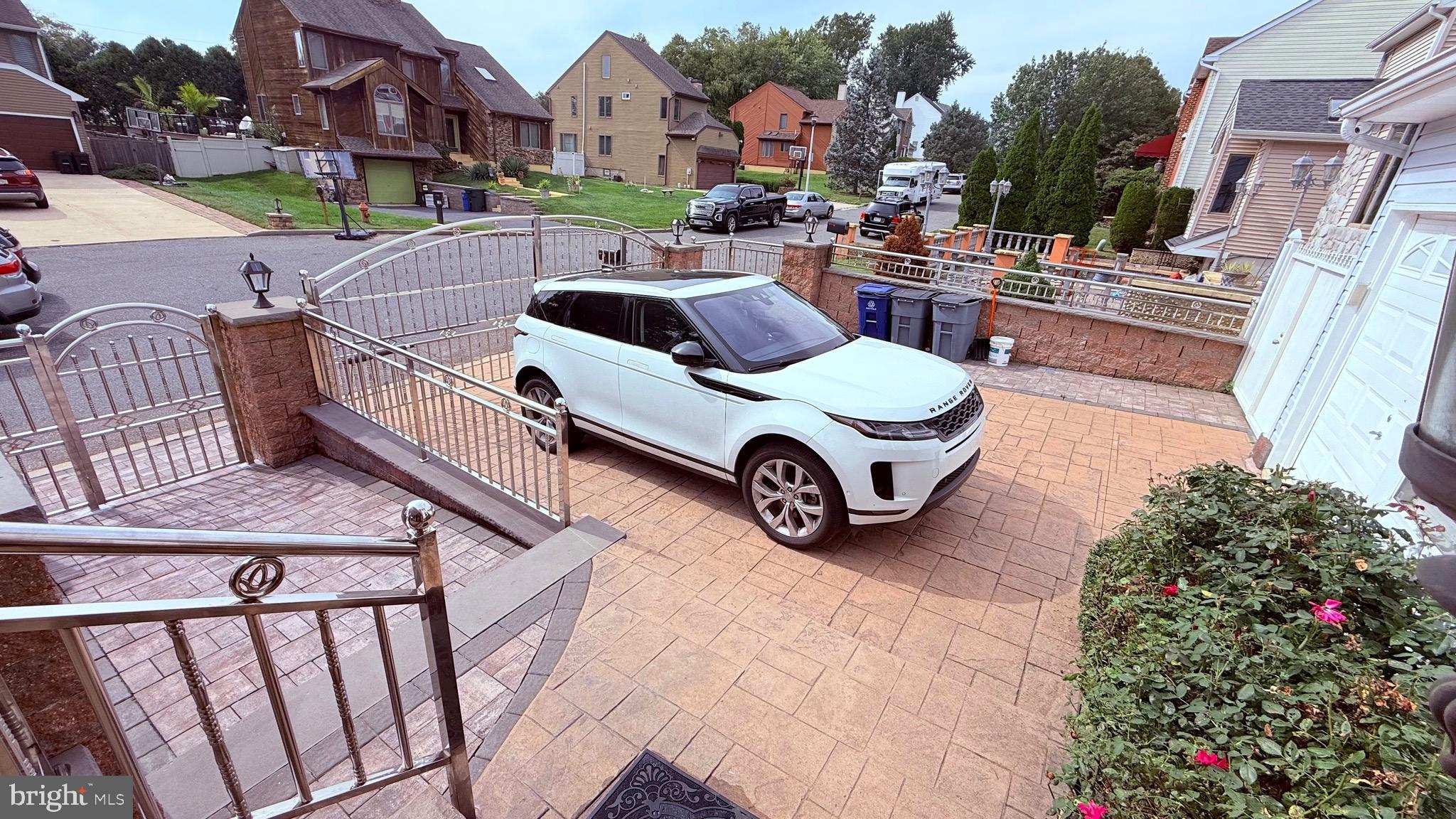 8905 Springview Road Philadelphia, PA 19115 - Photo 10 of 113 a car parked in front of a brick building