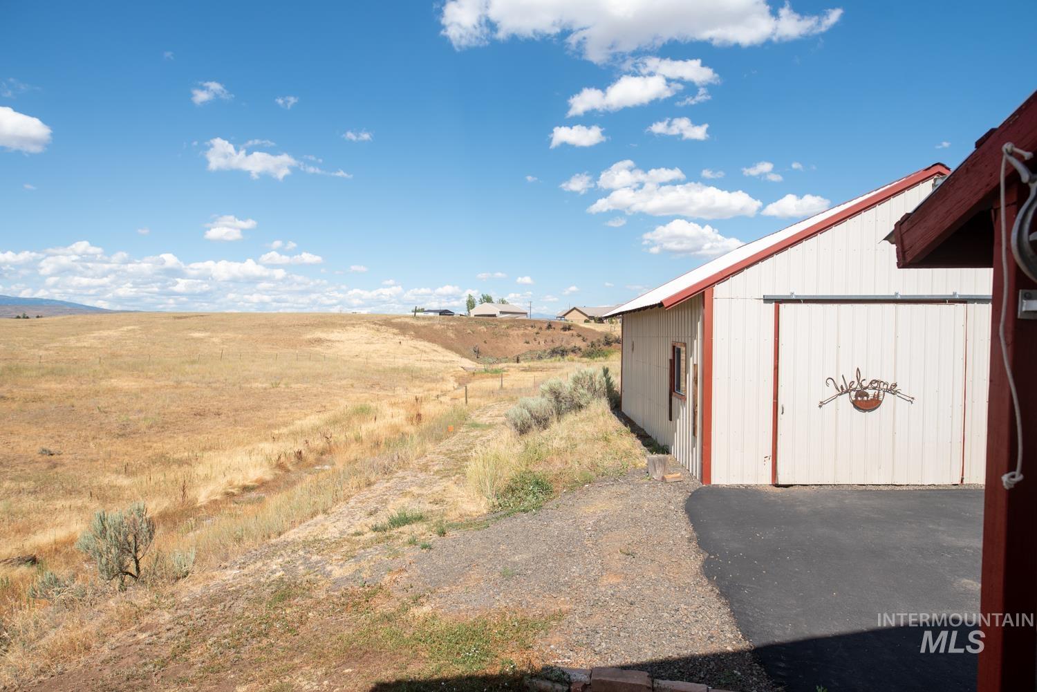 2240 Waite Road Midvale, ID 83645 - Photo 24 of 42 View of yard with an outbuilding and a view of countryside