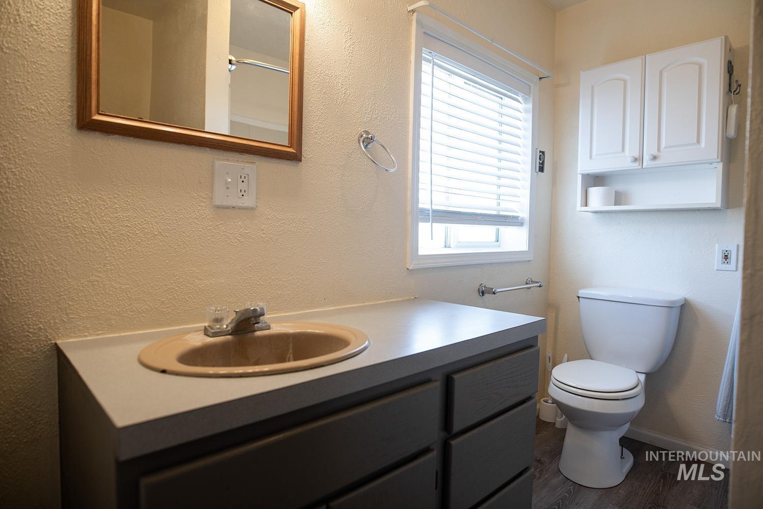2240 Waite Road Midvale, ID 83645 - Photo 7 of 42 Bathroom featuring vanity and wood finished floors
