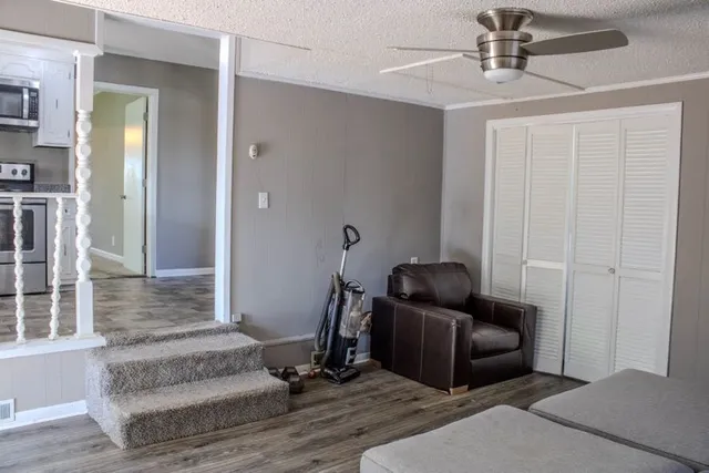 a living room with furniture and a rug