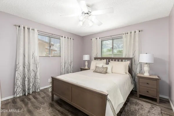 a bedroom with a bed and a table in it