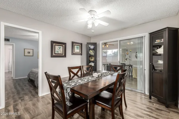 a view of a dining room with furniture and wooden floor