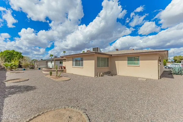 a view of house with yard outdoor outdoor seating