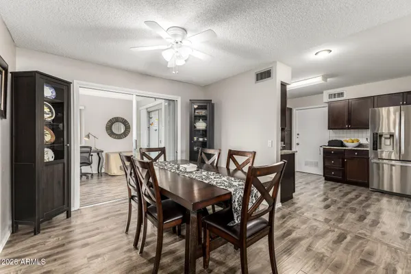 a view of a dining room with furniture and wooden floor