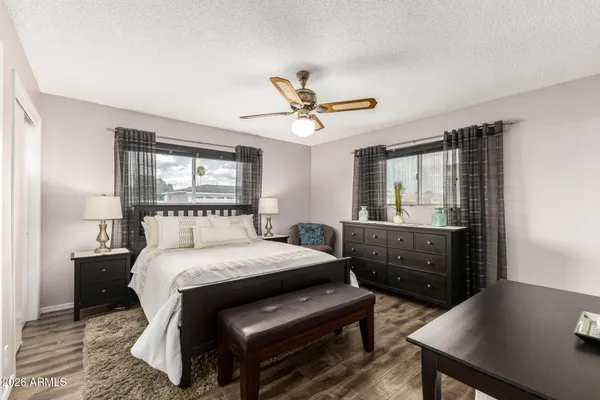 a bedroom with a bed and a table in it