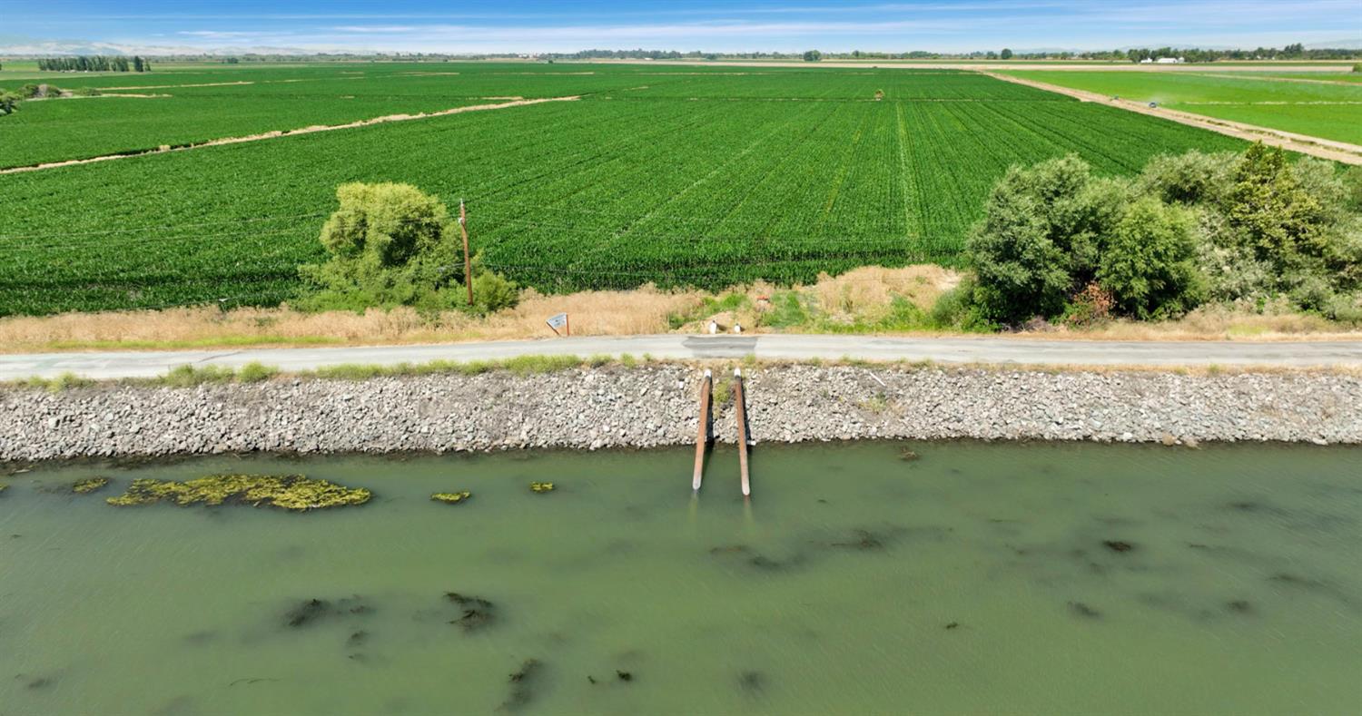 0 Tyler Island Road Walnut Grove, CA 95641 - Photo 2 of 39 a view of a lake from a yard