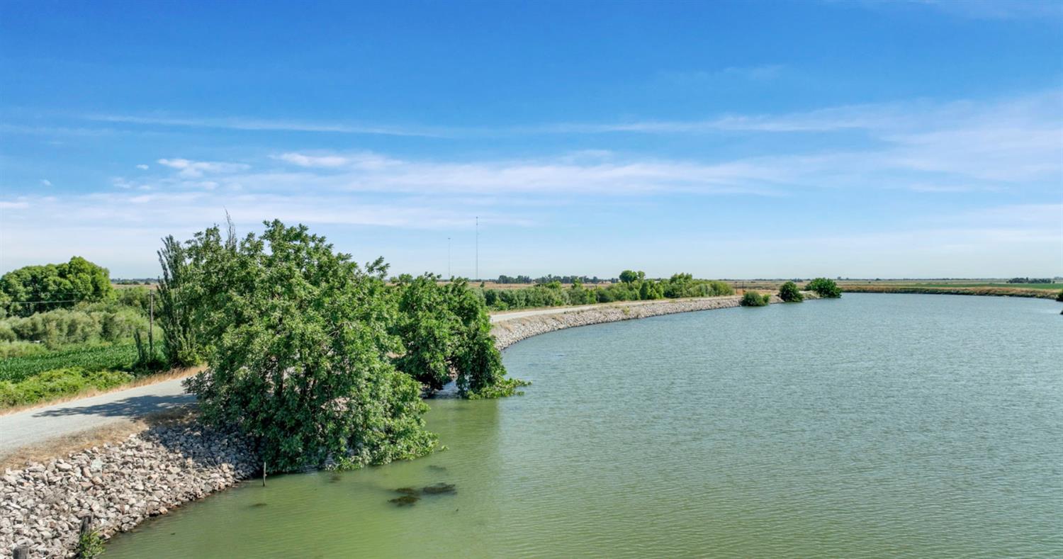 0 Tyler Island Road Walnut Grove, CA 95641 - Photo 23 of 39 a view of a lake with a city