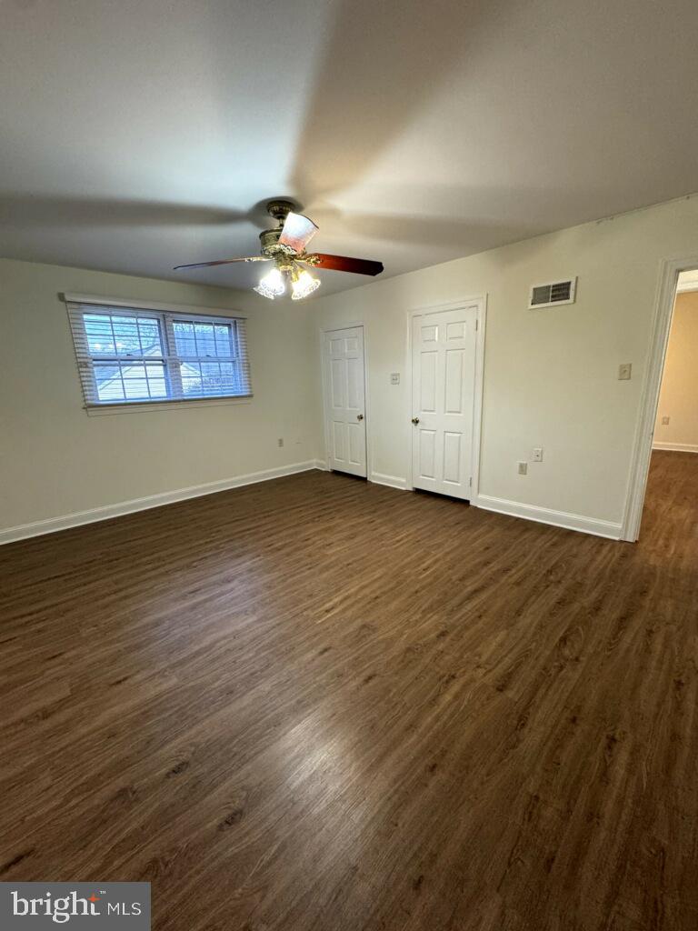 109 Yardley Commons Yardley, PA 19067 - Photo 11 of 19 an empty room with wooden floor and windows