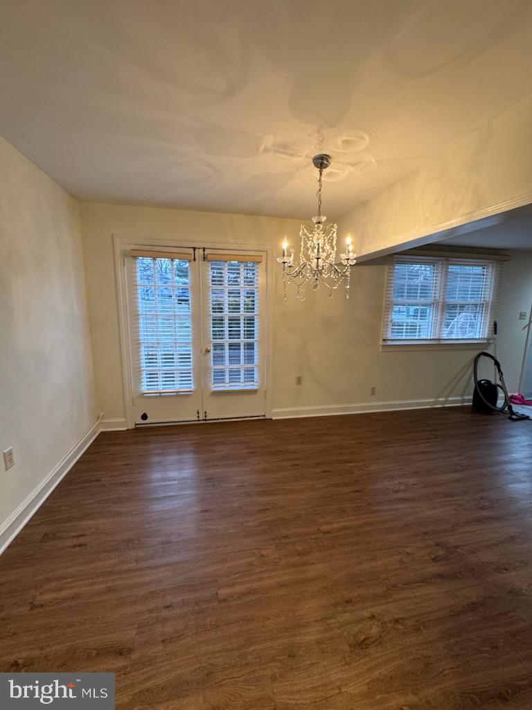 109 Yardley Commons Yardley, PA 19067 - Photo 3 of 19 an empty room with chandelier fan and windows