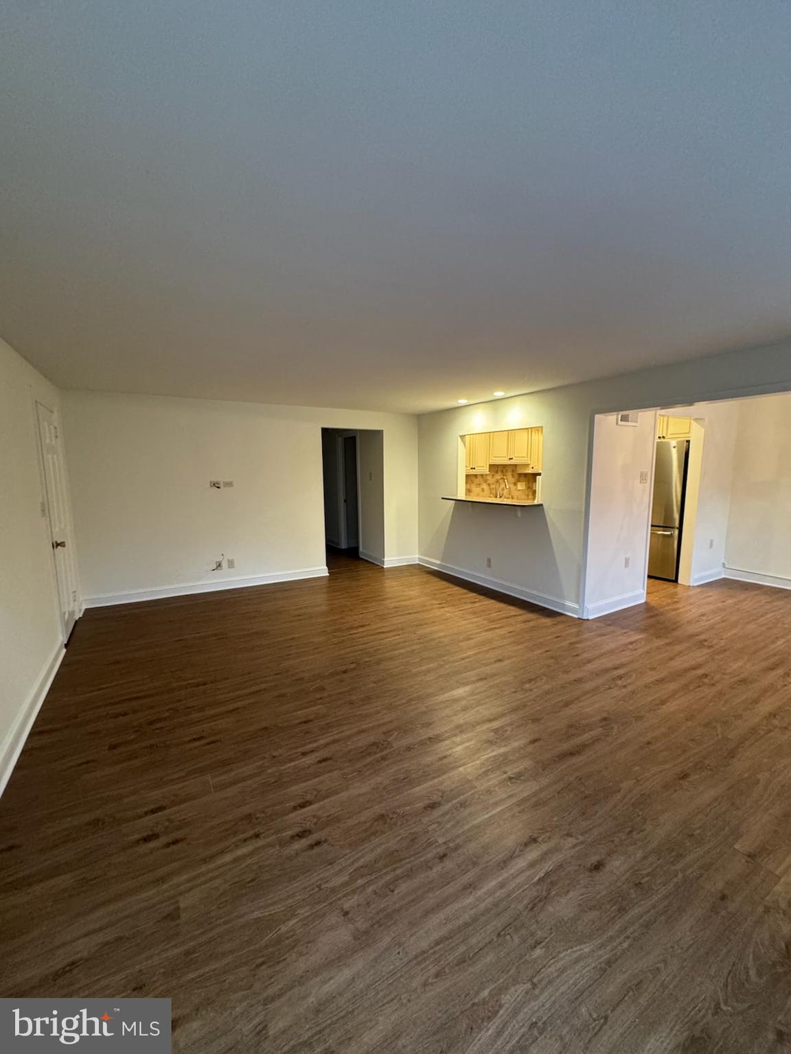 109 Yardley Commons Yardley, PA 19067 - Photo 5 of 19 a view of empty room with wooden floor and fan