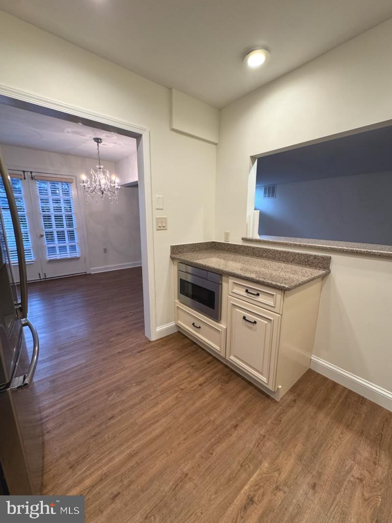 109 Yardley Commons Yardley, PA 19067 - Photo 6 of 19 a view of a kitchen with a sink and a stove top oven