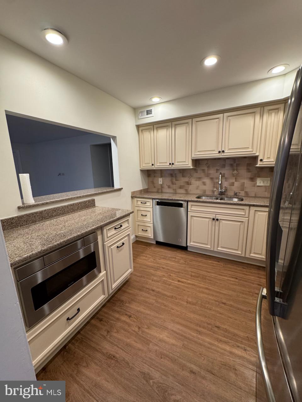 109 Yardley Commons Yardley, PA 19067 - Photo 7 of 19 a kitchen with stainless steel appliances a stove sink and microwave