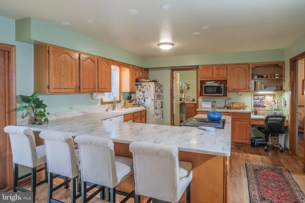 a kitchen with a refrigerator and a sink