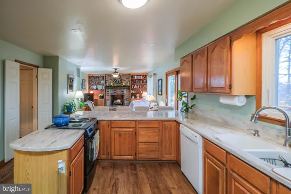 a view of a dining room with furniture and chandelier