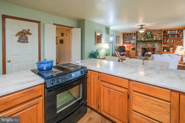 a view of a dining room with furniture and chandelier