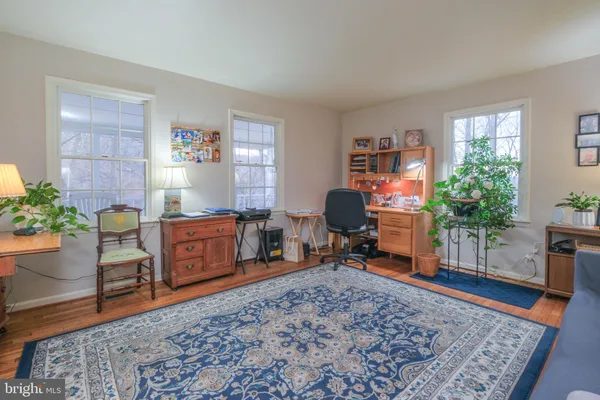 a bedroom with a bed and a bookshelf