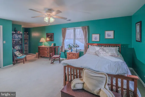 a view of a yard covered with snow in back