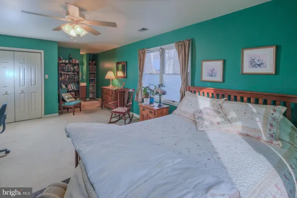 a view of a street with cars parked on road