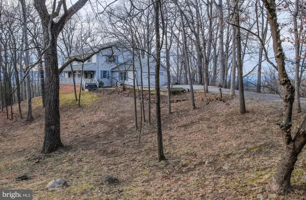 a view of balcony with wooden floor and outdoor seating