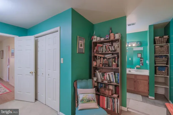 a view of a building with sitting area and furniture