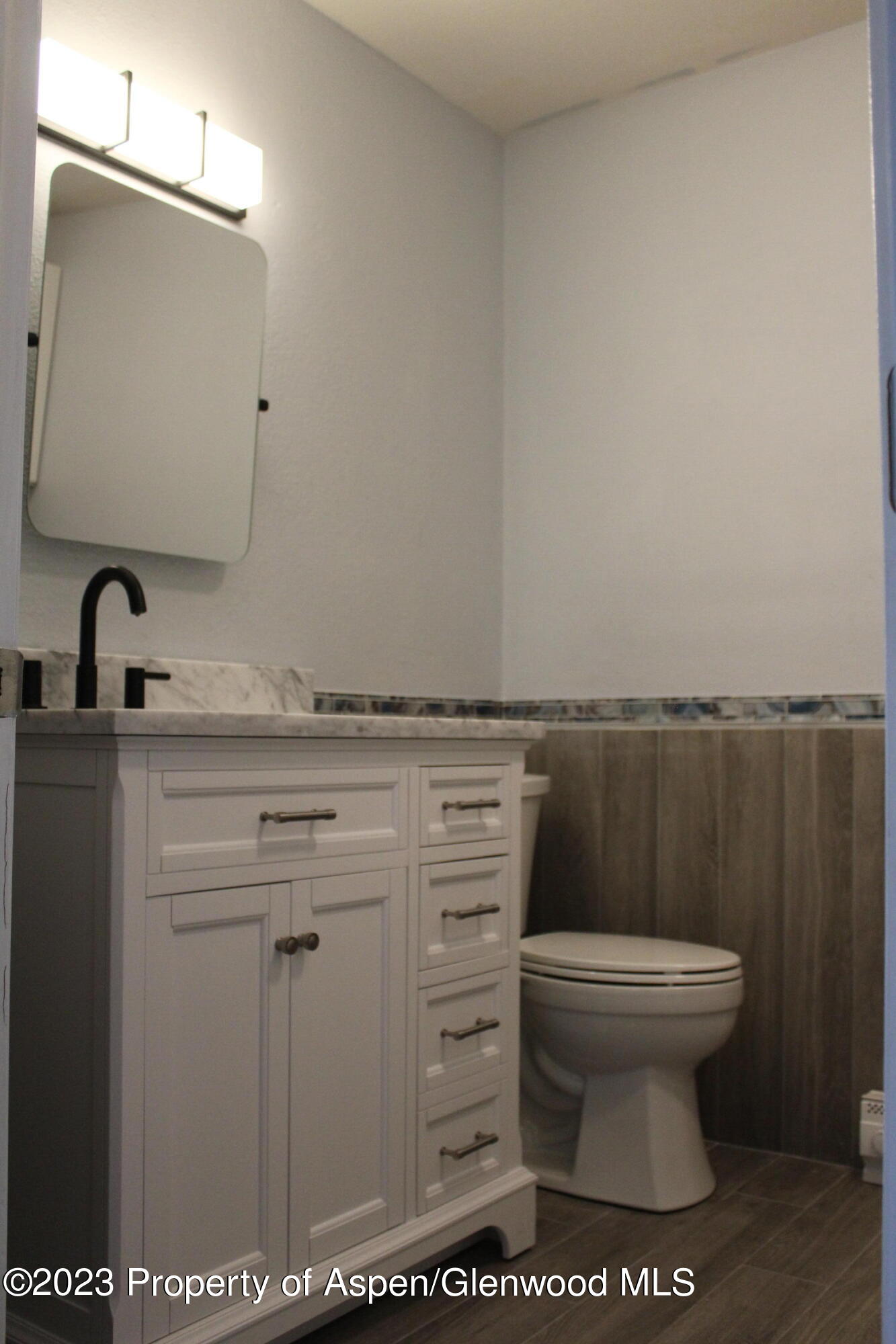 1322 East 7th Street, Unit 3 Rifle, CO 81650 - Photo 5 of 8 a bathroom with a toilet and a sink