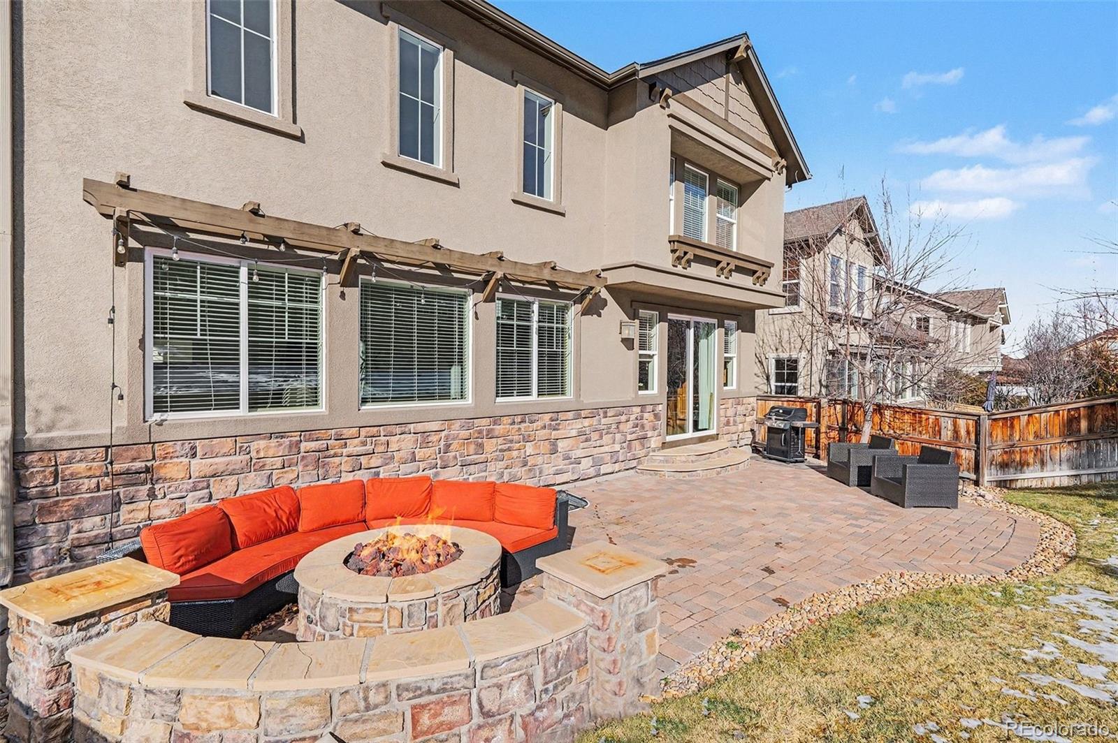 10869 Valleybrook Circle Highlands Ranch, CO 80130 - Photo 12 of 46 a outdoor space with the couches and kitchen view