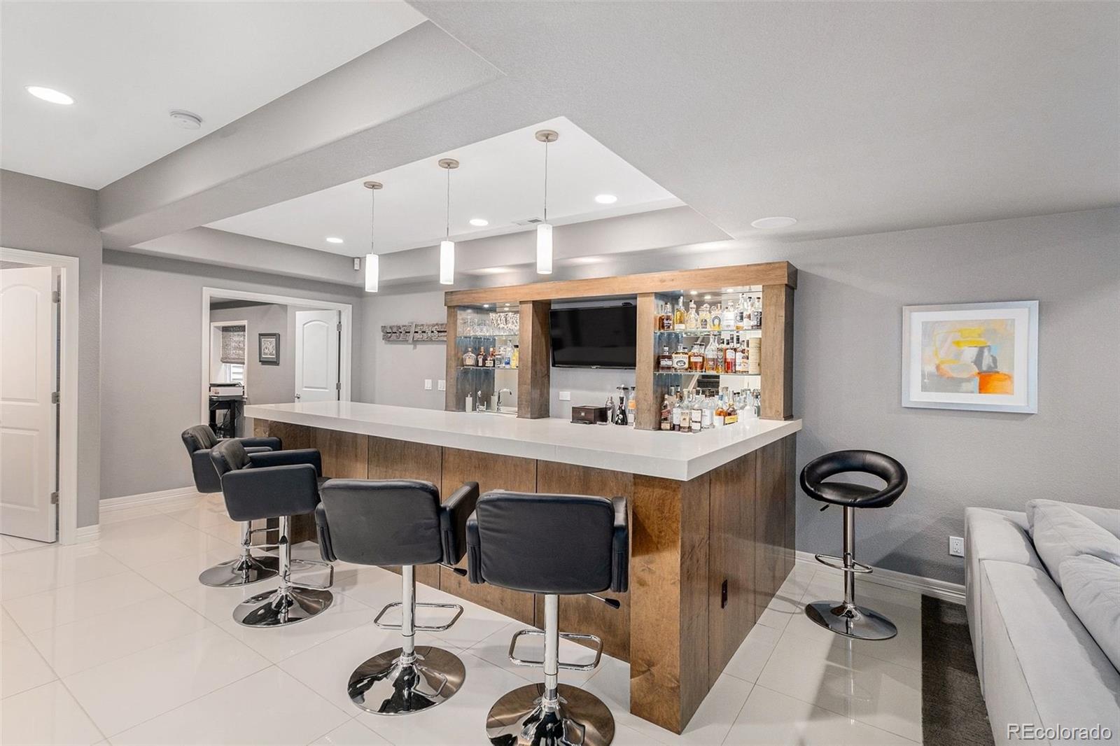 10869 Valleybrook Circle Highlands Ranch, CO 80130 - Photo 16 of 46 a view of a workspace with furniture and a window