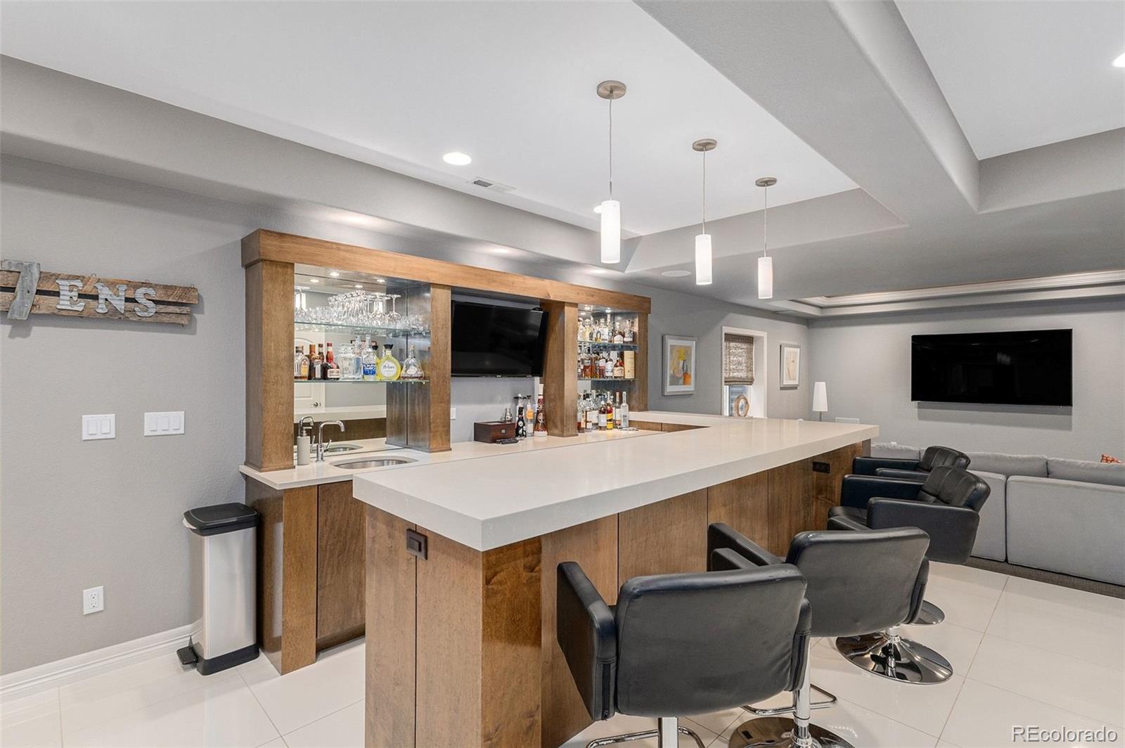 10869 Valleybrook Circle Highlands Ranch, CO 80130 - Photo 17 of 46 a large kitchen with a table and chairs