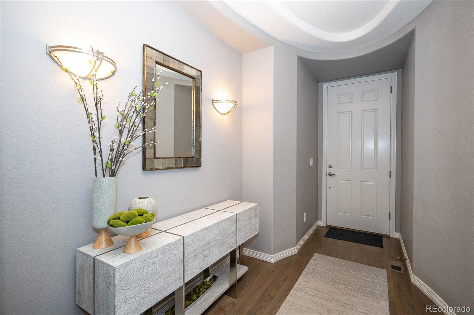 10869 Valleybrook Circle Highlands Ranch, CO 80130 - Photo 2 of 46 a room with painting and a table