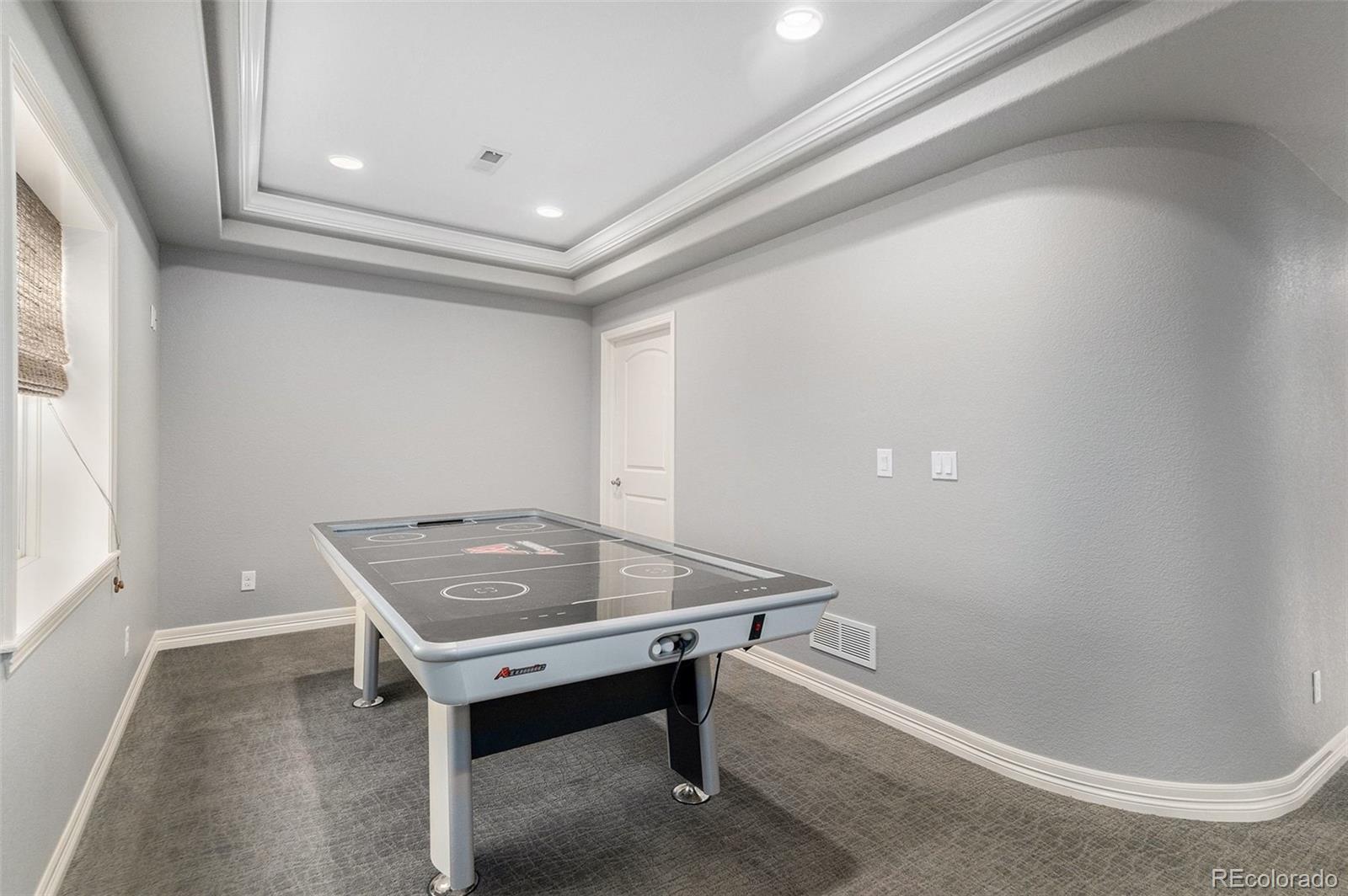 10869 Valleybrook Circle Highlands Ranch, CO 80130 - Photo 21 of 46 a room with furniture and window