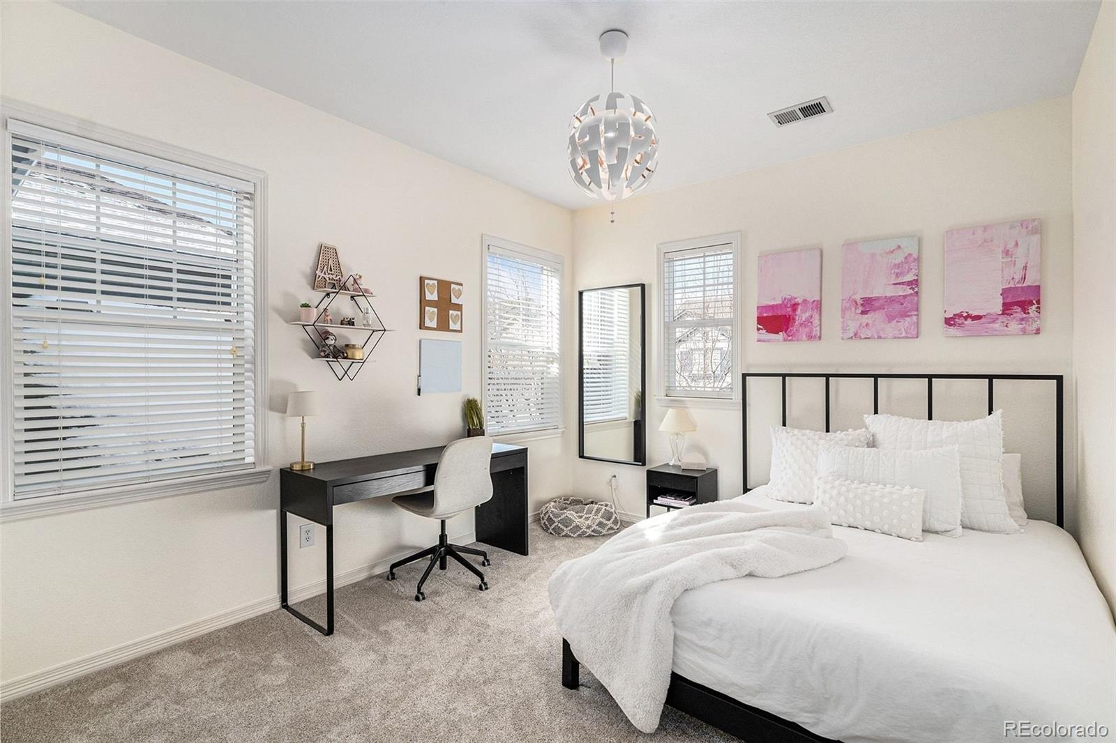 10869 Valleybrook Circle Highlands Ranch, CO 80130 - Photo 29 of 46 a bedroom with a bed and a desk