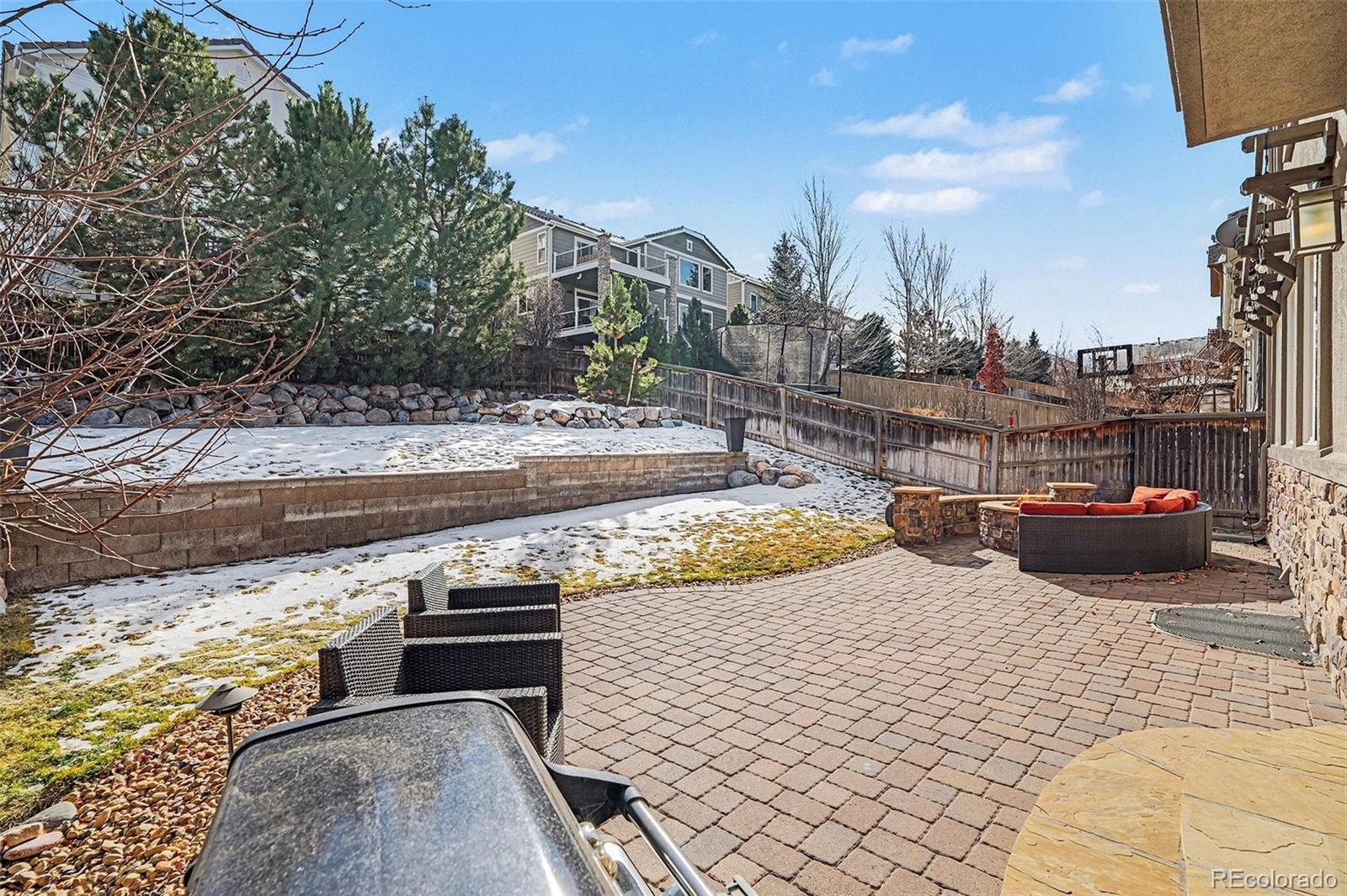 10869 Valleybrook Circle Highlands Ranch, CO 80130 - Photo 10 of 46 a view of a swimming pool with lounge chairs