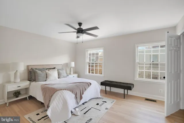 a bedroom with a bed furniture and a window