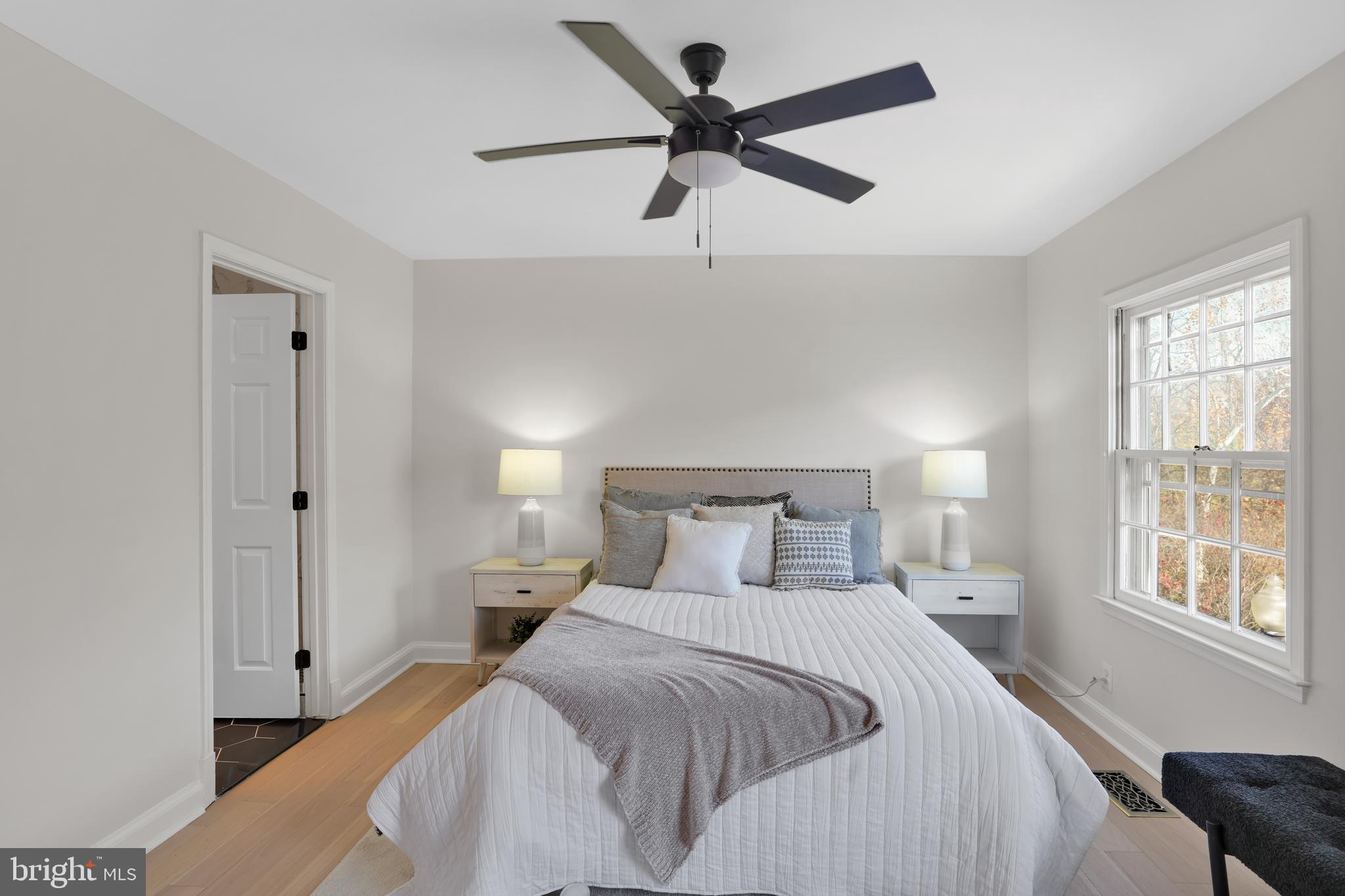 4339 Massachusetts Avenue Northwest, Unit 4339 Washington, DC 20016 - Photo 16 of 25 a bedroom with a bed and a large window