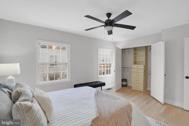 a bedroom with a large bed window and a window