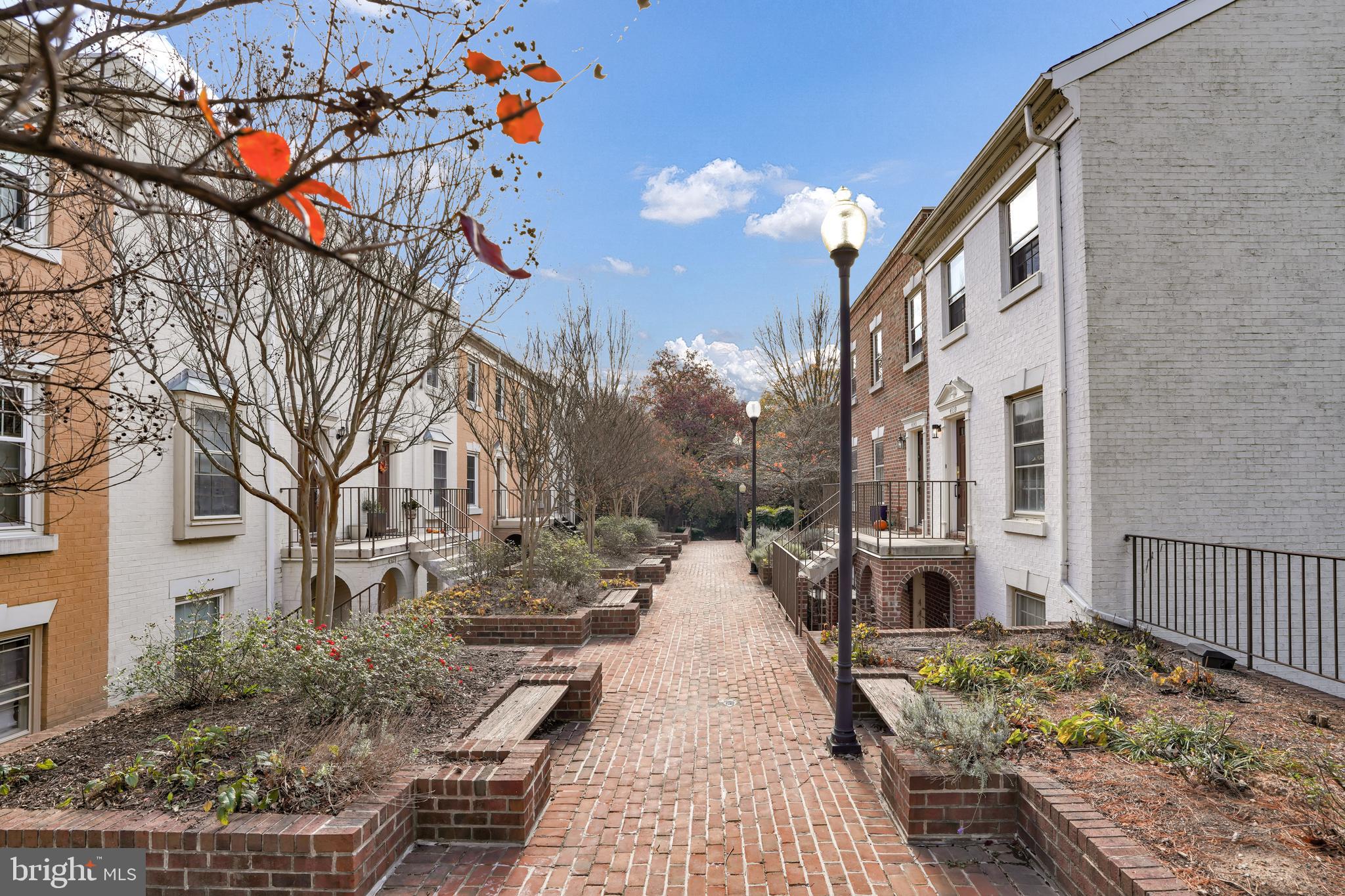 4339 Massachusetts Avenue Northwest, Unit 4339 Washington, DC 20016 - Photo 3 of 25 a view of a chairs and tables in the patio