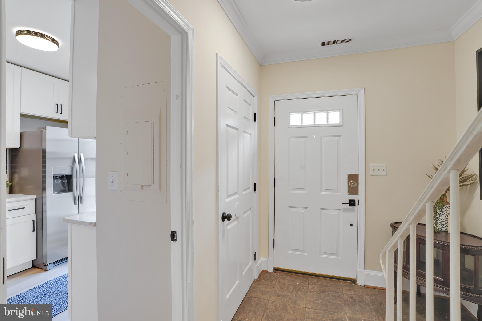 4339 Massachusetts Avenue Northwest, Unit 4339 Washington, DC 20016 - Photo 9 of 25 a view of a hallway with a livingroom and a window