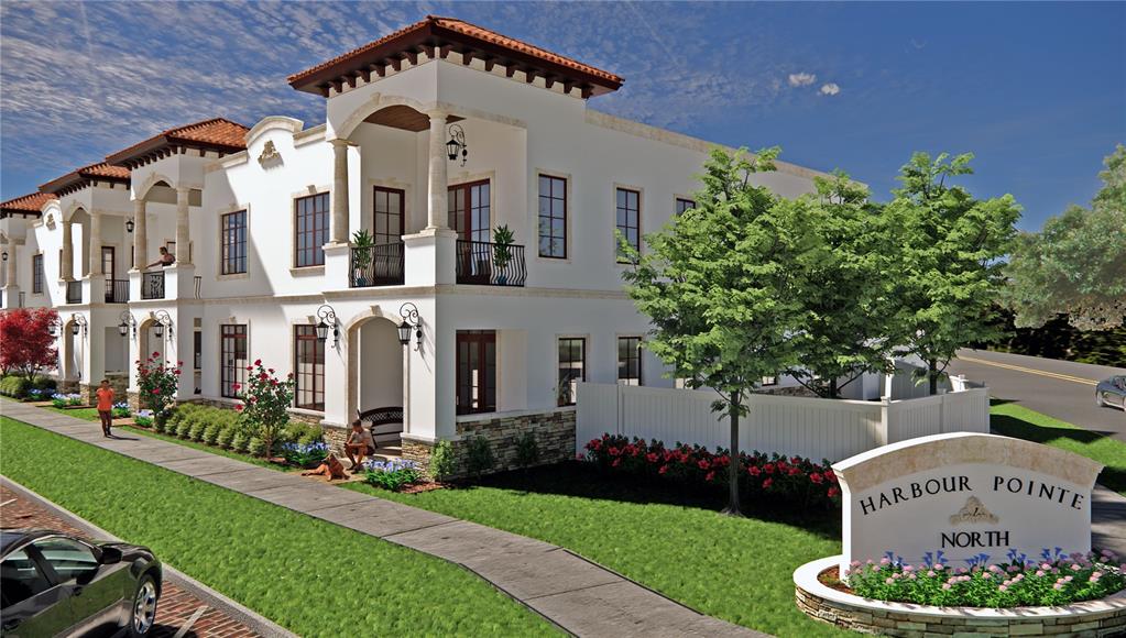 a large white building with a clock tower in the middle in front of it