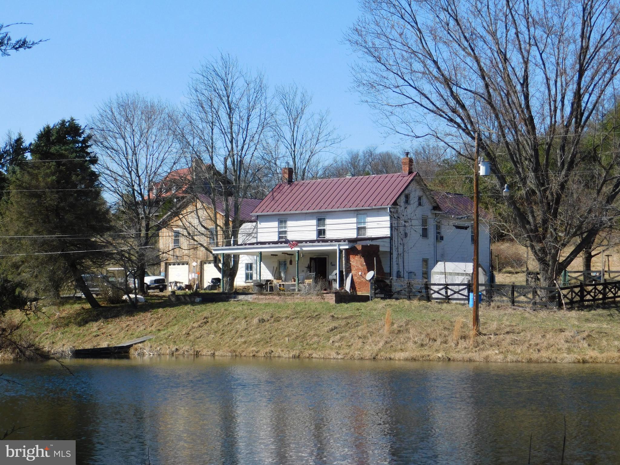 290 Howards Chapel Road Winchester, VA 22603 - Photo 5 of 30 Porch Facing Pond & Fence