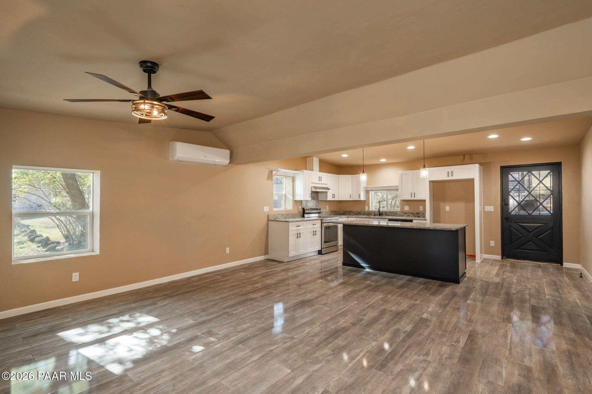 10101 Third Street Mayer, AZ 86333 - Photo 15 of 23 a large white kitchen with a large window appliances and cabinets