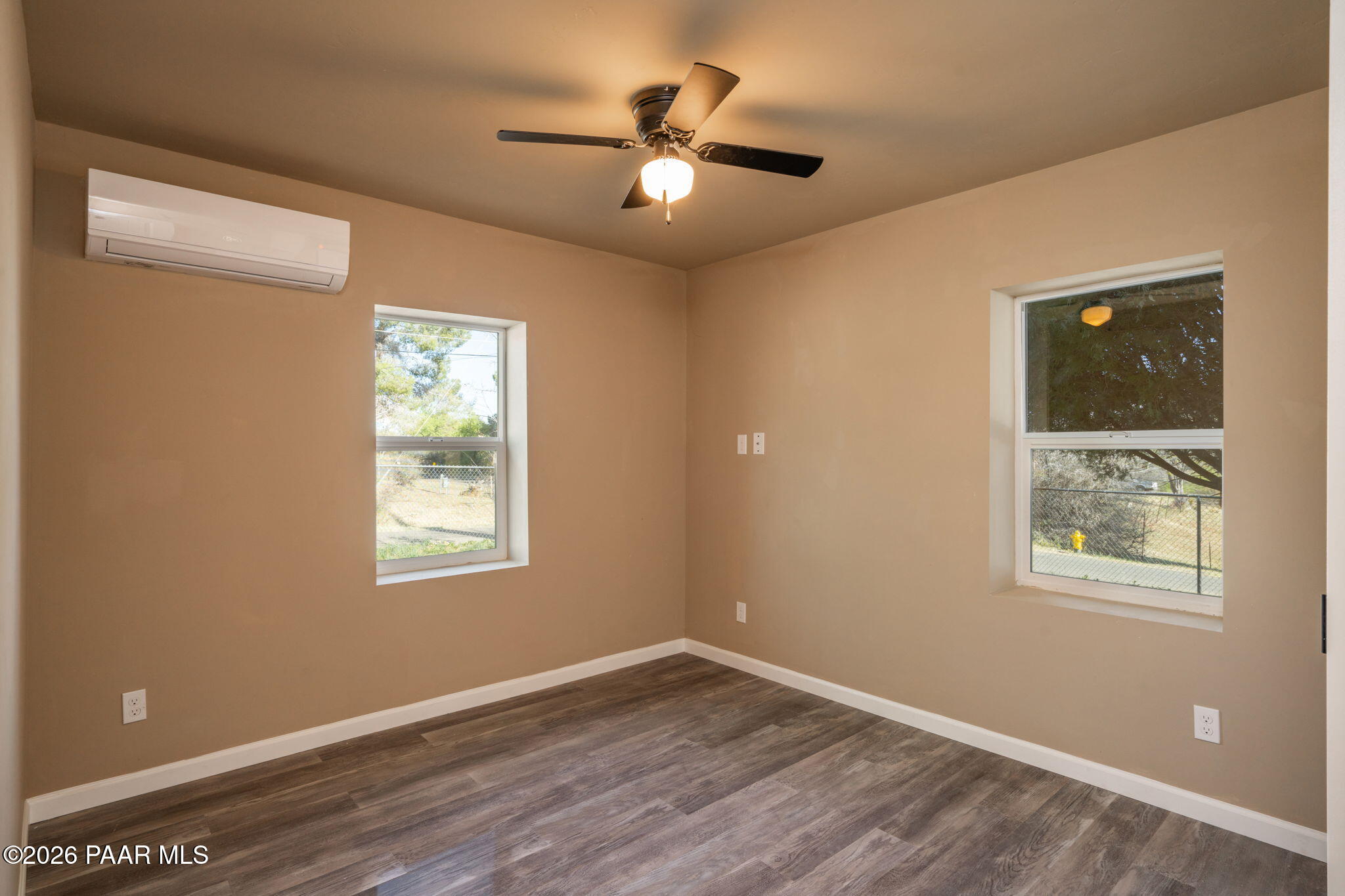10101 Third Street Mayer, AZ 86333 - Photo 16 of 23 a view of an empty room with wooden floor and a window