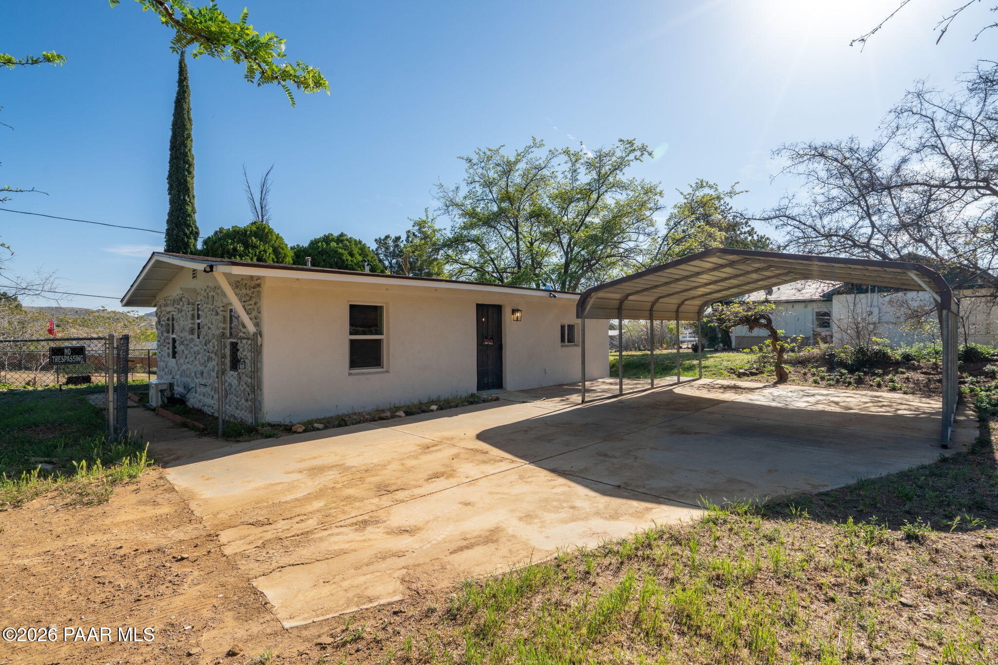 10101 Third Street Mayer, AZ 86333 - Photo 3 of 23 a view of backyard with a garden and trees