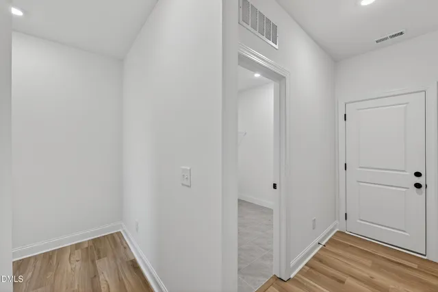 a bathroom with a shower and a glass door